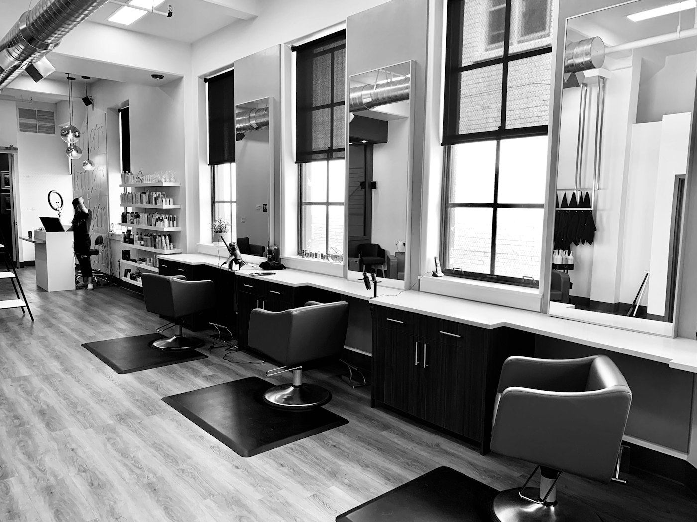 Salon interior with chairs in a row — parallel staff is when WhatsApp stops being a calendar