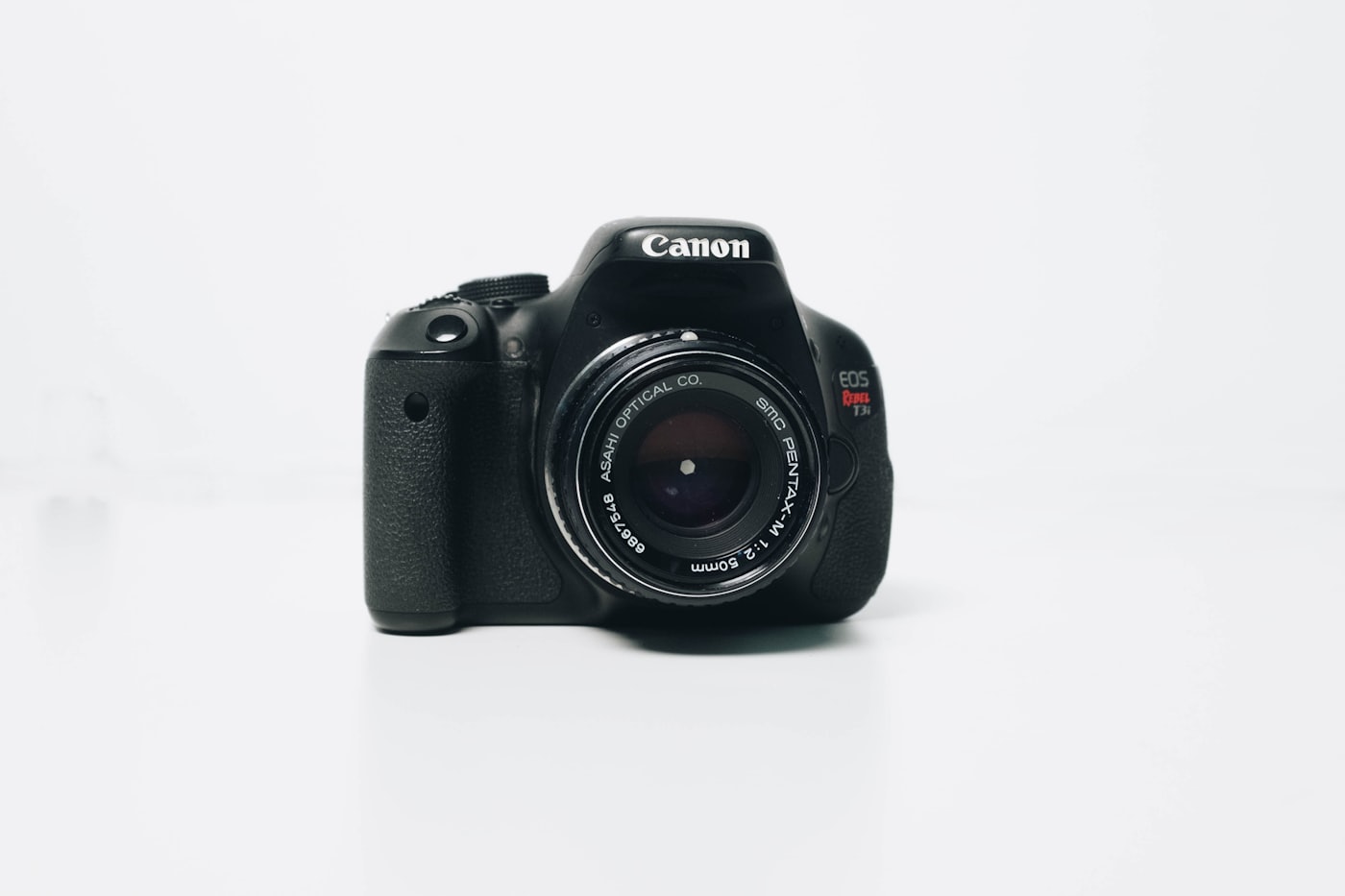 Camera lens close-up — shoot the real rooms, then compress the files for the web
