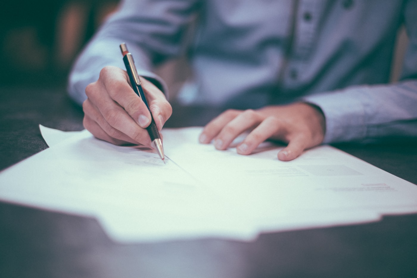 Signed documents on a desk — personal data a UAE website form collects