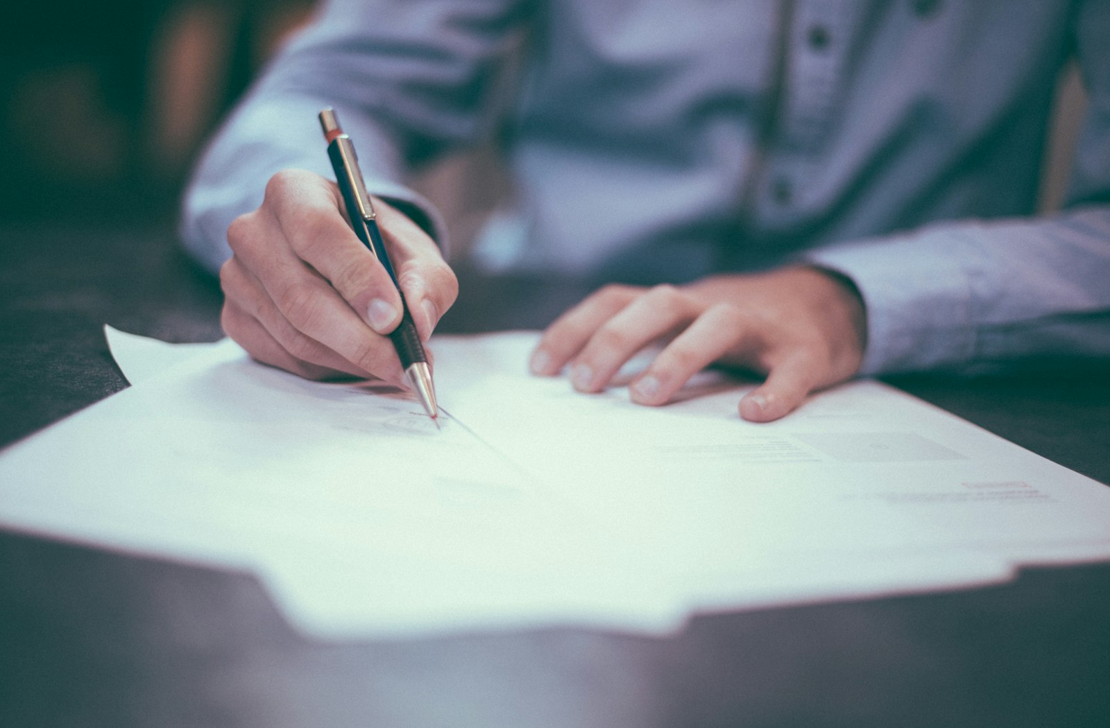 Person signing paperwork — domain and hosting accounts belong in the company name